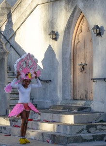 Nassau, Bahamas:  Boxing Day Junkanoo dancer putting on costume 12/26/13